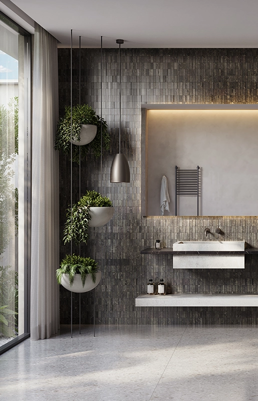 Modern bathroom with double sinks, large illuminated mirror, hanging plants, and walk-in shower.
