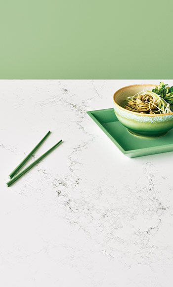 white veined counter with bowl of noodles