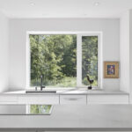 Modern kitchen with island in Caesarstone 4044 Airy Concrete 1993