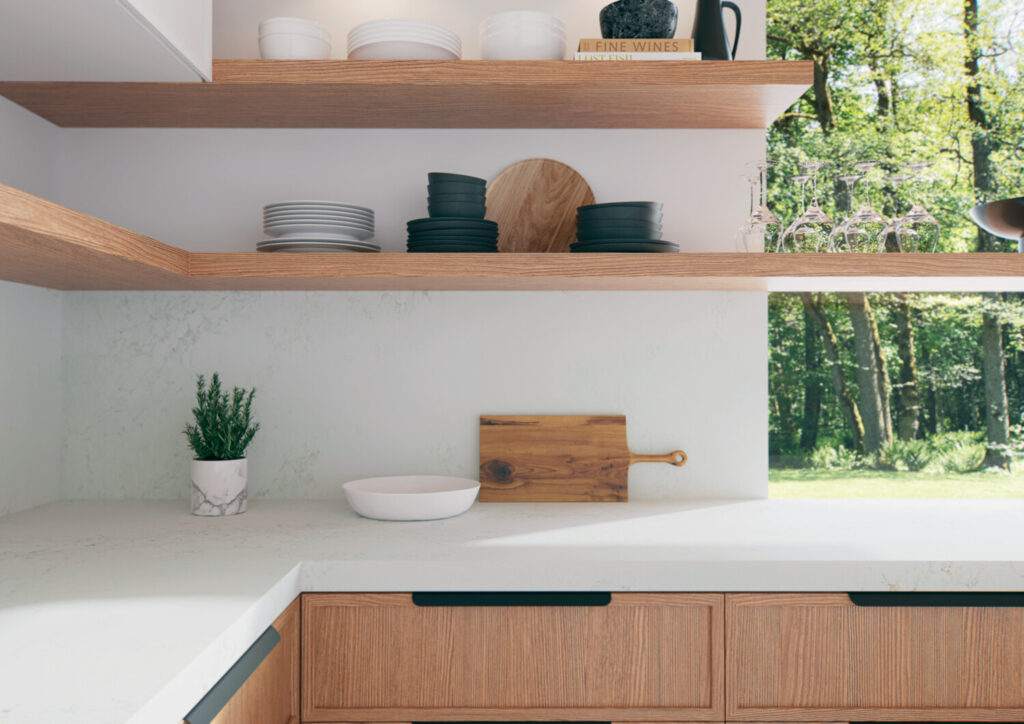 Kitchen with white quartz countertops and utensils 