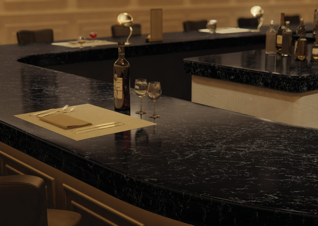 Black with white veins bar countertop with table setting 