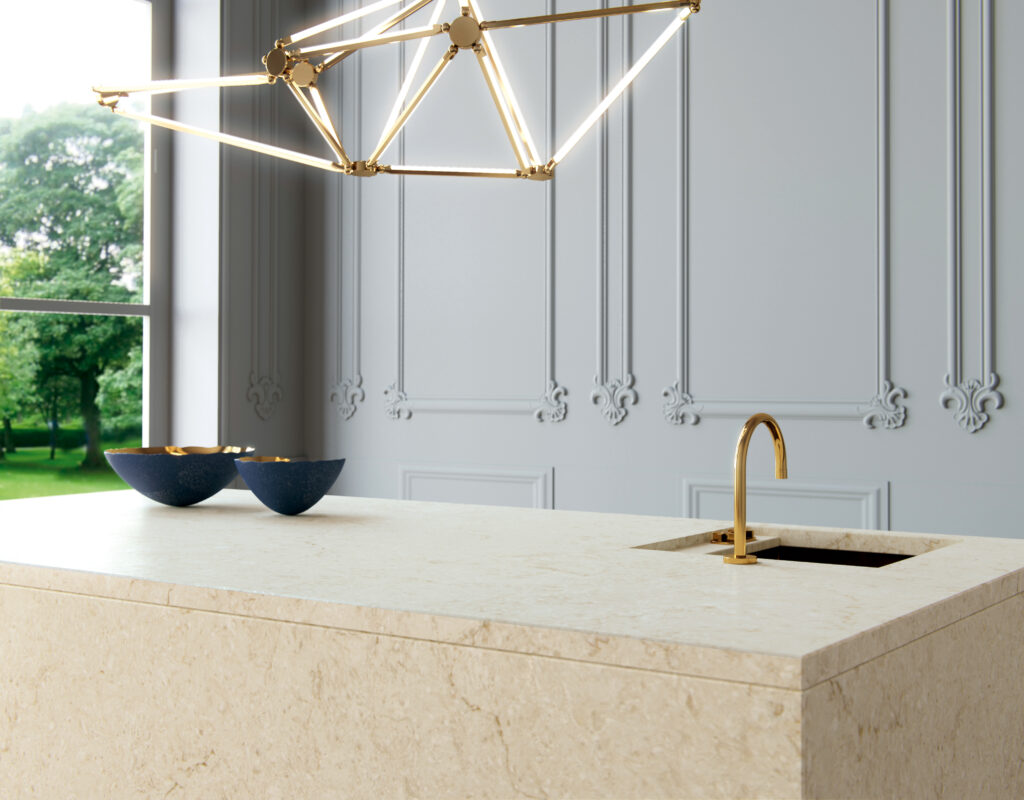 beige kitchen island with gold faucet

