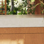 Caesarstone Porcelain 507_Marbannova surface in modern bathroom with plants