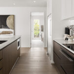 Caesarstoen 5132 Celestial Sky surfaces in project with Developer/Contractor Carlisle Homes - Modern kitchen and bathroom