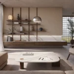 Minimalist living room with neutral tones, modern furniture, open shelving, large windows, and natural light.
