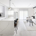 Caesarstone porcelain 504 Lumena surface in a modern kitchen with island design by Revital Marciano photography Ido Ganor