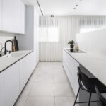 Caesarstone porcelain 504 Lumena surface in a modern kitchen with island design by Revital Marciano photography Ido Ganor