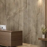 Modern reception area with wooden furniture, two iMacs, pendant lights, and neutral decor with Caesarstone porcelain 513 Striata flooring and cladding