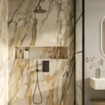 Caesarstone porcelain cladding 536 Antikella in Luxurious bathroom with walk-in shower, rain showerhead, recessed shelf, illuminated mirror, and sleek vanity.